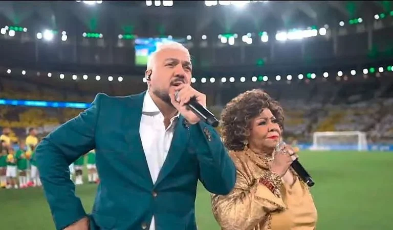 Era melhor deixar o samba morrer: Alcione e Belo cantam Hino Nacional antes de jogo do Brasil e web detona performances. Vexame